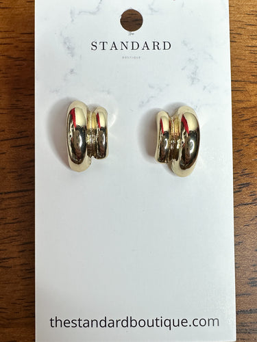 Gold polished double-dome stud earrings displayed on The Standard Boutique earring card